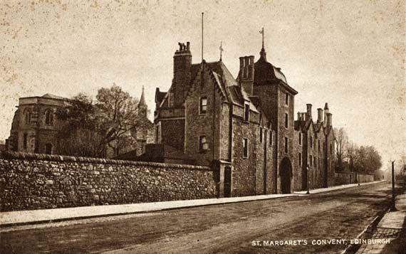 A black and white image of an old walled building