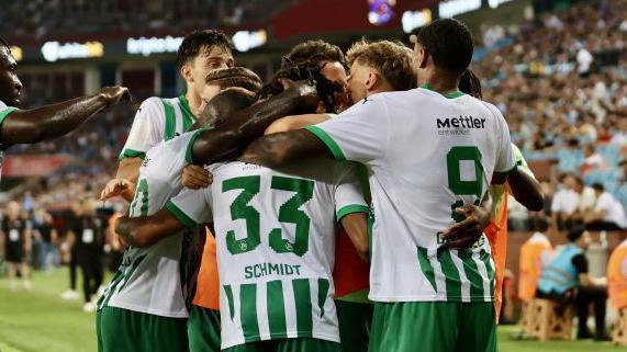 St Gallen players celebrate a goal against Trabzonspor