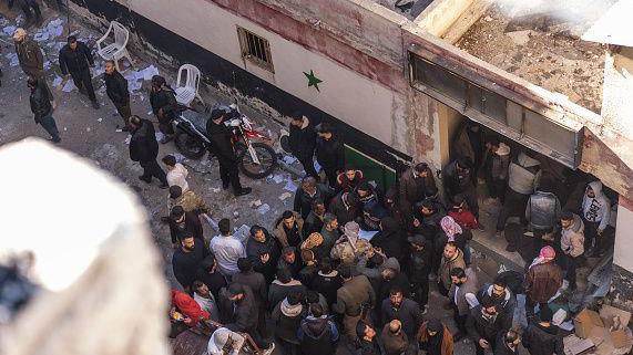 Crowds gathering outside Saydnaya military prison hoping for information about family members