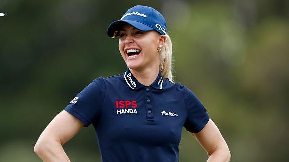 Charley Hull laughs on the course