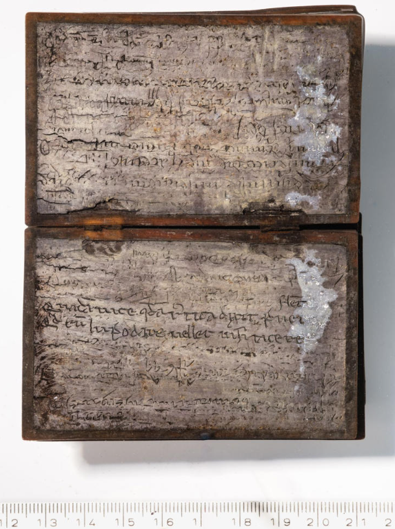 Picture of the book opened on the wax pages 