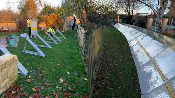 A collage of two images showing the Hinksey barrier being activated. 