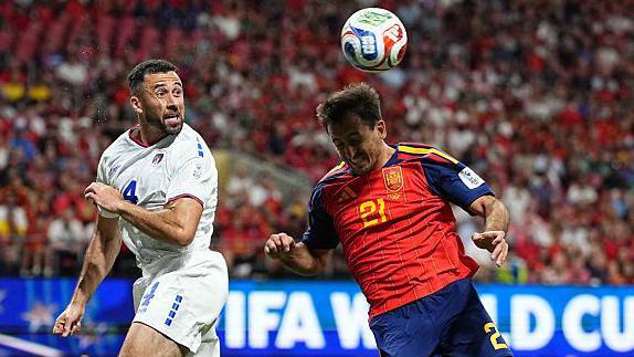 Roberto Lopes heads the ball clear against Spain