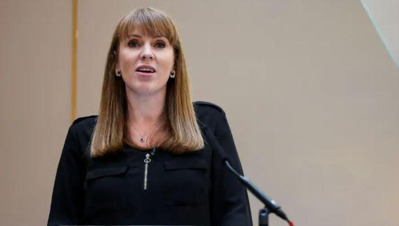 Deputy Prime Minister Angela Rayner speaking into microphone, wearing black dress