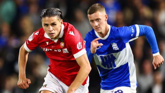 George Dobson being chased by Birmingham's Jay Stansfield