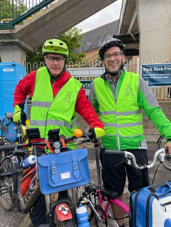 Two cyclists with bikes