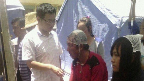 Injured people receive treatment at a clinic after a 6.6 magnitude earthquake hit Dingxi, Gansu province 22 July, 2013