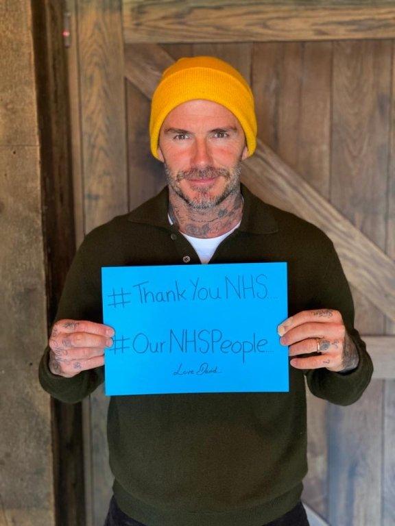 david beckham with a thank you NHS sign