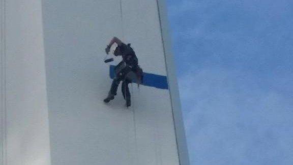 Man painting Spinnaker Tower