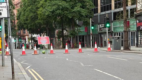 A line of cones across a usually busy city centre street