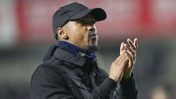 Lewis Young claps the travelling support following Dagenham & Redbridge's FA Cup defeat at Millwall 