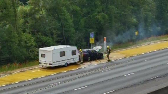 Firefighter tackling a car fire on the M1