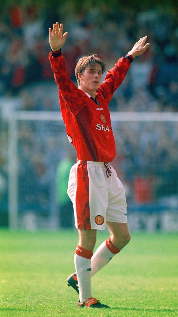 David Beckham celebrates scoring from the halfway line against Wimbledon in 1996
