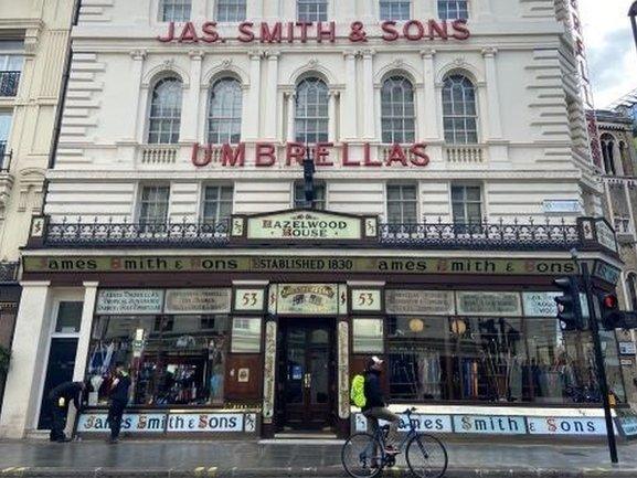 James Smith and Sons Umbrella shop with umbrellas in the window.