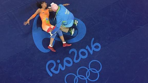 7: An injured Vinesh Vinesh of India is treated during a Women's Freestyle 48kg Quarterfinal bout against Yanan Sun of China on Day 12 of the Rio 2016 Olympic Games at Caioca Arena 2 on August 17