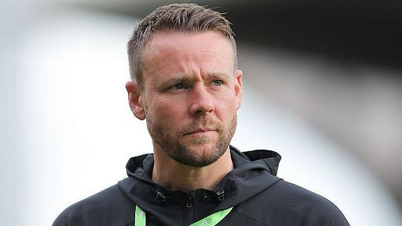 Chris Gunter looks on before a game