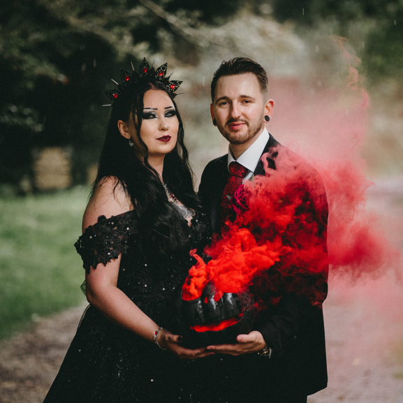 Hannah and Mathew pose in their wedding outfits