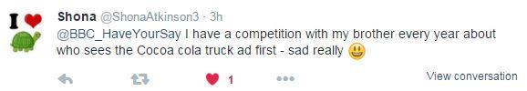 Tweet: " I have a competition with my brother every year about who sees the Cocoa cola truck ad first - sad really" with a smiley emoji