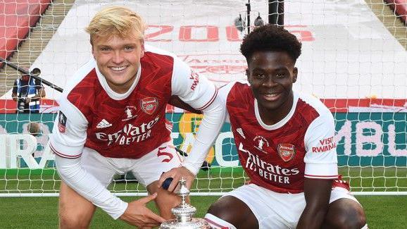 Matt Smith and Bukayo Saka celebrate Arsenal's 2-1 FA Cup Final win over Chelsea at Wembley in 2020