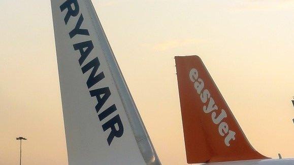 Tail fins of EasyJet and Ryanair planes