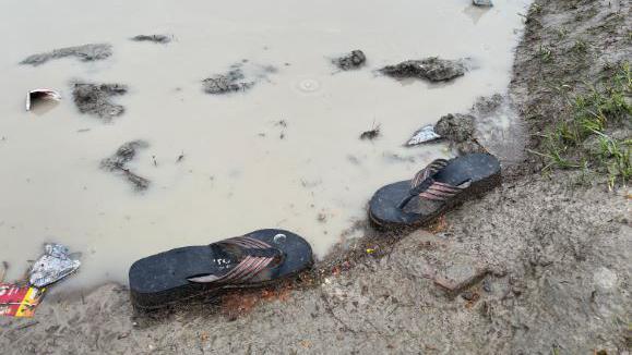 Slippers strewn outside the venue of the event 