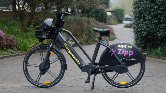 A black and purple e-bike in a park