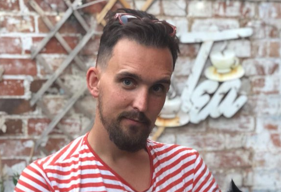 Man wearing red and white stripy top