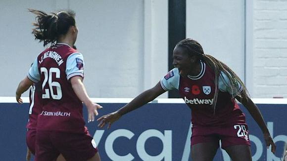 West Ham attacker Viviane Asseyi celebrates scoring against Leicester City.