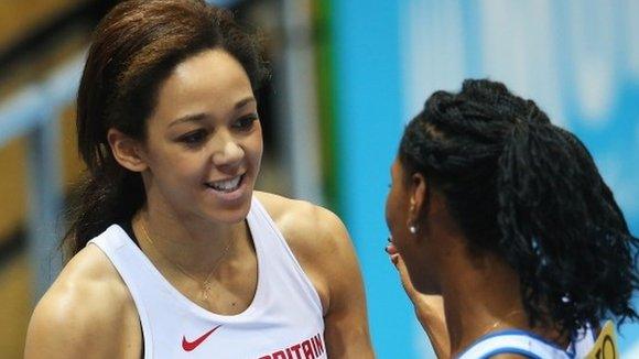 Katarina Johnson-Thompson (left) of Great Britain celebrates winning the silver medal with gold medalist Eloyse Lesueur of France