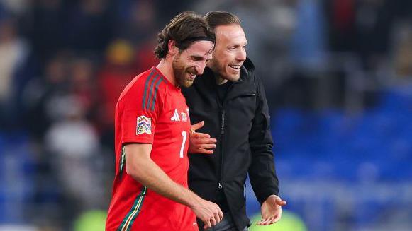 Joe Allen (left) with Wales manager Craig Bellamy