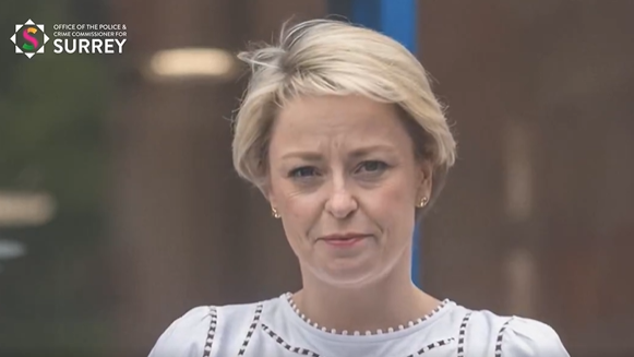 A screenshot of the AI deepfake video showing the fake Lisa Townsend with short blonde hair and a white top