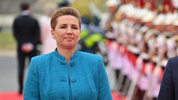 Denmark's Prime Minister Mette Frederiksen and her husband Bo Tengberg arrive to attend the International commemorative ceremony at Omaha Beach marking the 80th anniversary of the World War II "D-Day" Allied landings in Normandy, in Saint-Laurent-sur-Mer, in northwestern France, on June 6, 2024. 