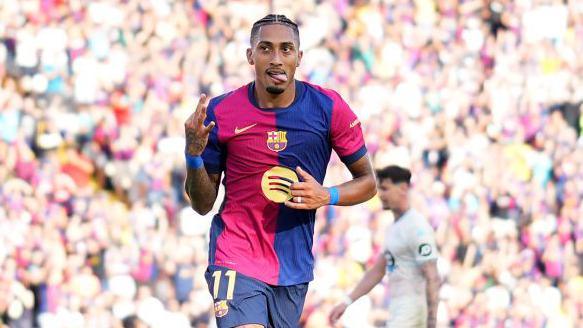 Raphinha celebrating scoring three for Barcelona