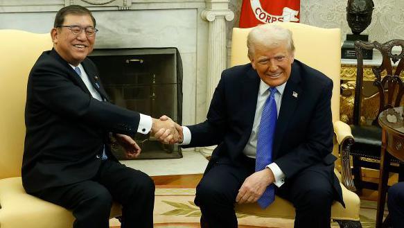 US President Donald Trump, right, and Shigeru Ishiba, Japan's prime minister, shake hands during a meeting in the Oval Office of the White House.