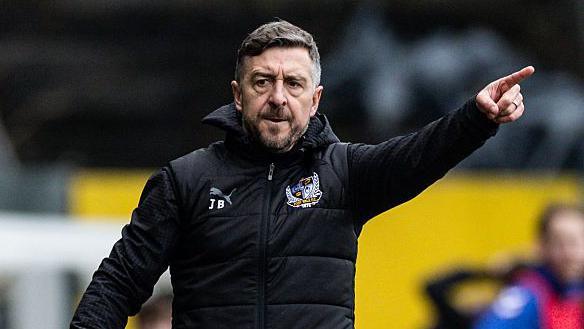 Jon Brady points out some instructions from the touchline during a Port Vale match