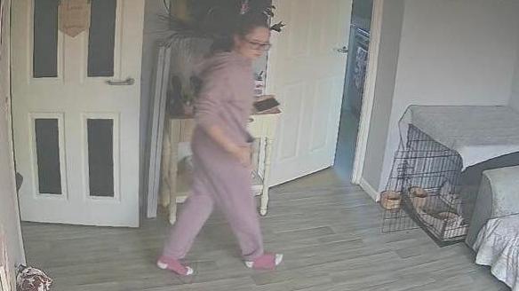 Tia Henderson was captured entering her living room on a home security camera.