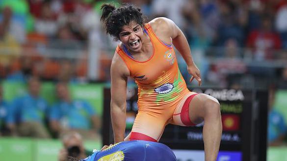 Sakshi Malik of India celebrates victory against Aisuluu Tynybekova of Kyrgyzstan during their Women's Freestyle 58 kg Bronze Medal Final at the Carioca Arena 2 on August 17, 2016 