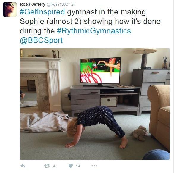 Sophie (almost 2) is practising Gymnastics on the living room carpet