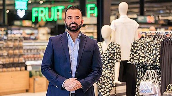 Marks & Spencer's chief executive Stuart Machin pictured in one of the retailer's shop wearing a dark blue suit jacket and light blue shirt