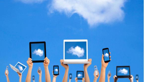 People holding laptops up to the sky