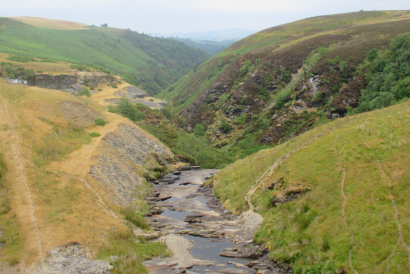 A dried up river in the middle of a valley