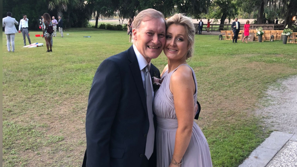 Katie Amess in a lilac dress with her father Sir David Amess