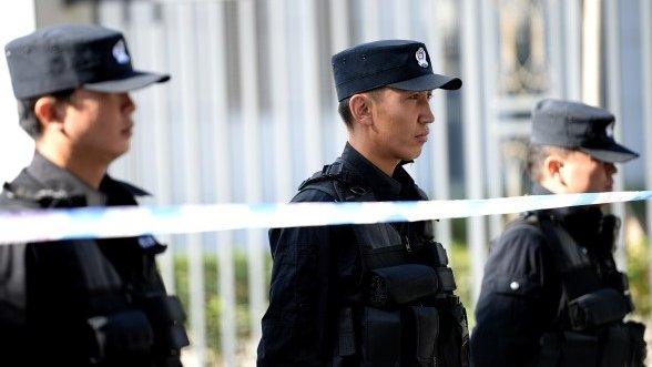 Chinese police guard an Urumqi court