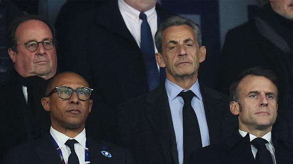 (1st row from L) French Football Federation (FFF) President Philippe Diallo, France's President Emmanuel Macron, (second row from L) former French President Francois Hollande and former French President Nicolas Sarkozy stand ahead of the UEFA Nations League League A, Group A2 football match between France and Israel at The Stade de France stadium in Saint-Denis, in the northern outskirts of Paris, on November 14, 2024. (