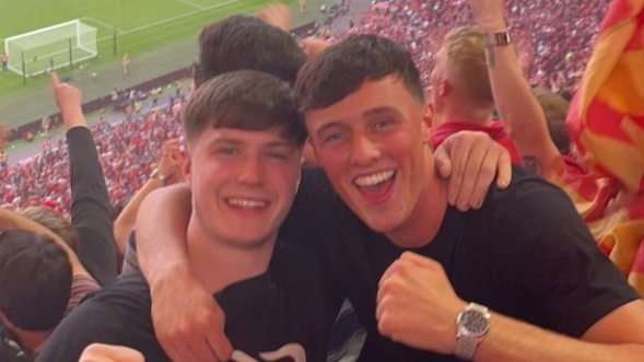 Accrington Stanley's Josh Woods (right) with his friend Adam Jones at Wembley celebrating Liverpool's win over Chelsea in the 2022 FA Cup final