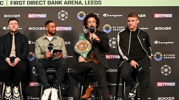 Blair Cobbs speaks into a microphone