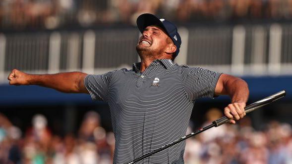 Bryson DeChambeau celebrates his victory on the 18th green