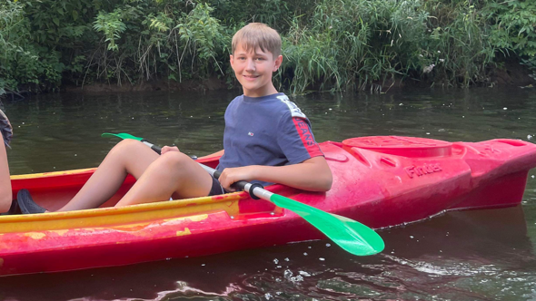 Alan pictured before the accident in a kayak