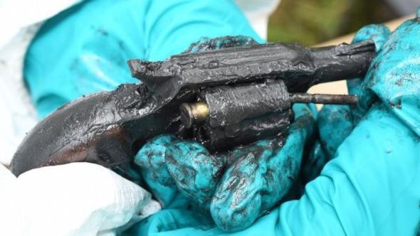 Revolver held by scene of crime officer