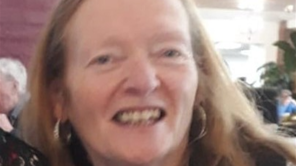 Rose Johnston, smiling with light red hair